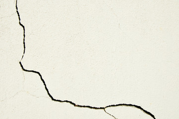 Large crack at a corner of a white wall