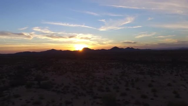 Sunset behind mountains aerial - High-definition footage