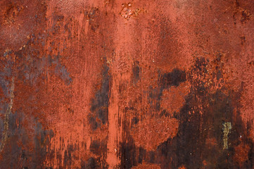 Red painted metal with rust texture background