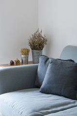 Sofa with dry plant decorated on side table
