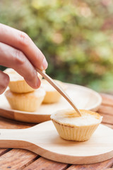Mini pies on wooden plate