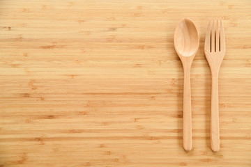 Wooden spoon and fork on table