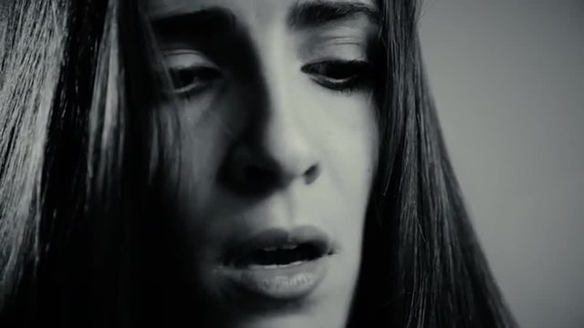 Black and white portrait of sad woman almost crying