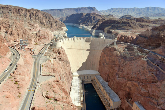 Hoover Dam, a massive hydroelectric engineering landmark located on the Nevada and Arizona border built to harness power from the Colorado River, is a top tourist attraction from Las Vegas