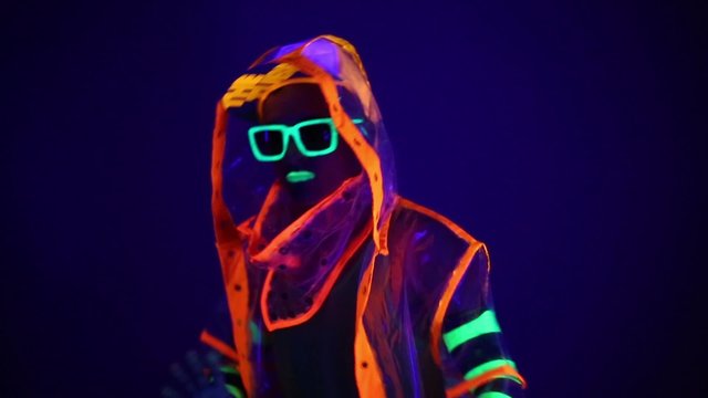 Guy dancing in neon costume