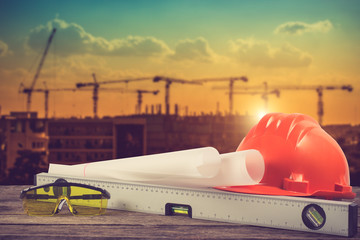 engineer working table plan and blueprint at building constructi