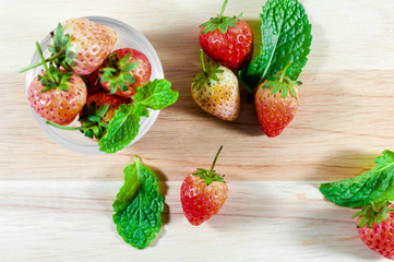 Fresh strawberries on wooden background. selective center focus