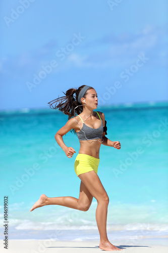 Fit Female Athlete Runner Running On Beach Full Length Body Full Length Body Of Woman Jogging Fast Barefoot On Sand Training Doing Her Cardio Workout During Summer Vacation Living A Healthy Lifestyle