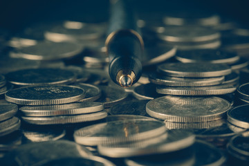 money concept coins and pen with filter effect retro vintage sty