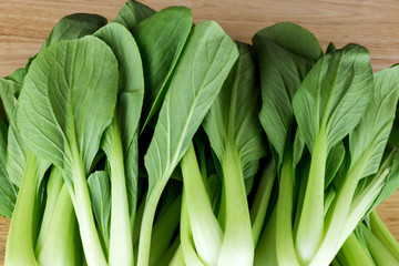Bok Choy Leaves on Wooden Table