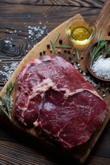 Top view of raw fresh rancho beefsteak, closeup, selective focus