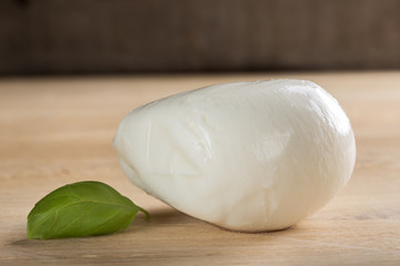Buffalo mozzarella on wooden table