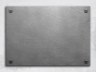 Brushed metal plate on wall