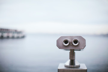 metal binoskop overlooking the water