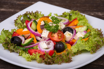 Fresh vegetable greek salad on the table.