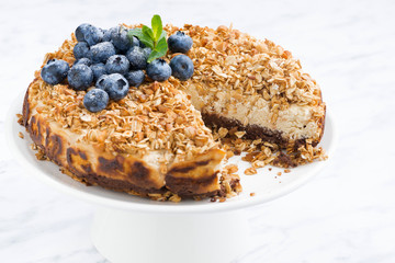 cheese pie with oat flakes on a stand