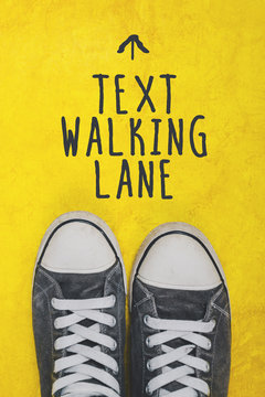 Text walking lane, casual sneakers top view