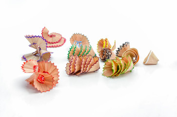 Color pencil shaves on white.