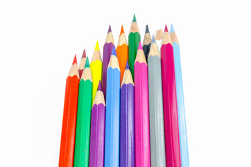 Many colored wooden pencils on white.