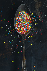 Colorful Sugar Balls in vintage spoon