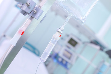 Intravenous drip of medicine on the background of a hospital bed