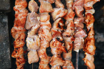 shashlik meat on brazier mangal roasting  in row