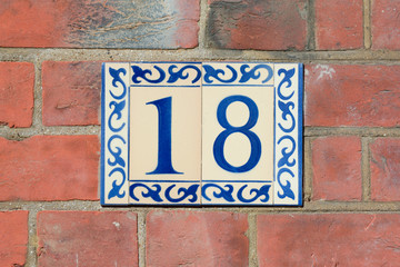 House number 18 sign