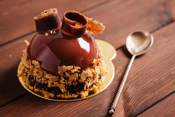 French mousse cake covered with chocolate glaze