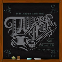 hand draw white chalk on board tailor shop calligraphy text with niddle and spool