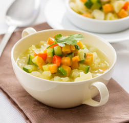 Colorful vegetable soup in a bowl