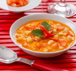Chickpea soup on a red background