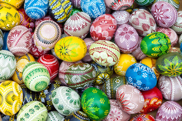 Colorful pile of decorated easter eggs, full frame background