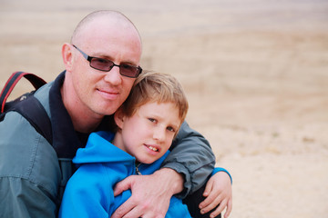 Portrait of father and son outdoors