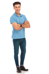 hipster in blue shirt posing with arms crossed