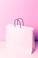 Shopping bag on lilac background