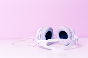 Headphones on lilac background