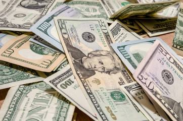 different US Dollar and Euro bills on table