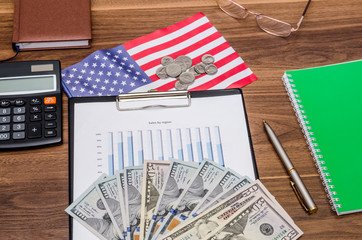 Business concept with graph, calculator, money with usa flag