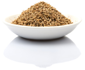 Dried dill herbs in white bowl over white background