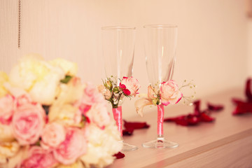wedding glasses of pink color and flowers