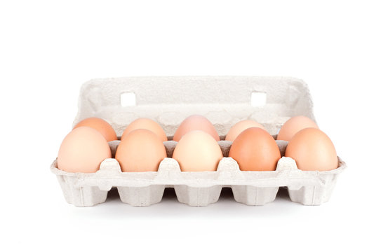 Ten eggs in a carton package isolated