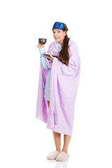 Morning woman wrapped in coverlet.