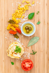 Italian food concept pasta with vegetables olive oil and spices