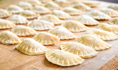 Making of homemade dumplings pastry tortellini or ravioli