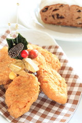 Christmas decoration food, chicken nugget with Stollen on background,