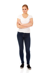 Fototapeta premium Worried young woman with folded arms