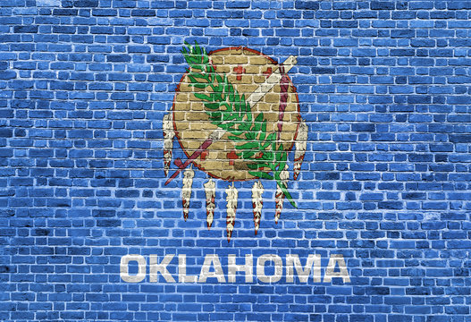 Oklahoma US flag painted on old vintage brick wall