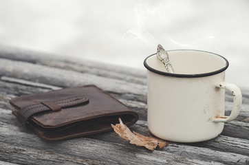 Hot drink and old purse