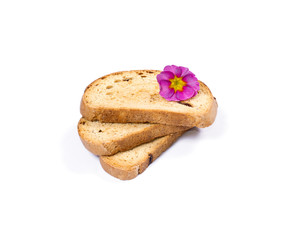 three croutons decorated with a pink flower