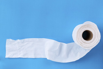 Tissue paper roll on the blue background.